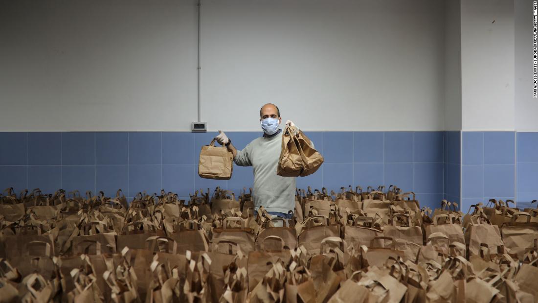 A member of the Don Bosco Foundation delivers food from the Fraternitas Project, which serves vulnerable families in Seville, Spain, on April 16.